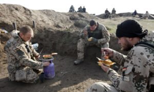 Soldiers eating freeze dried food